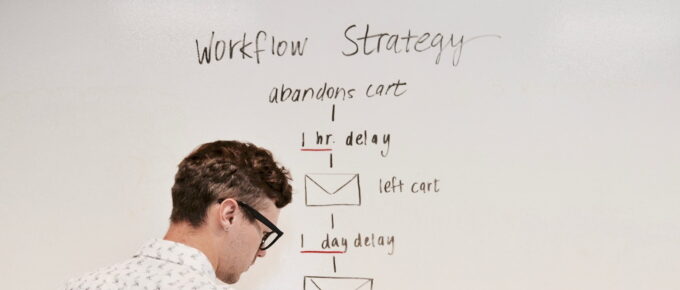 man writing on whiteboard