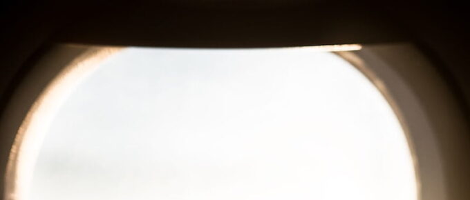 person holding paper plane